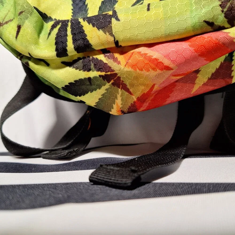 Vibedration Hydration Backpack w/o bladder - green, orange, black leaves - used